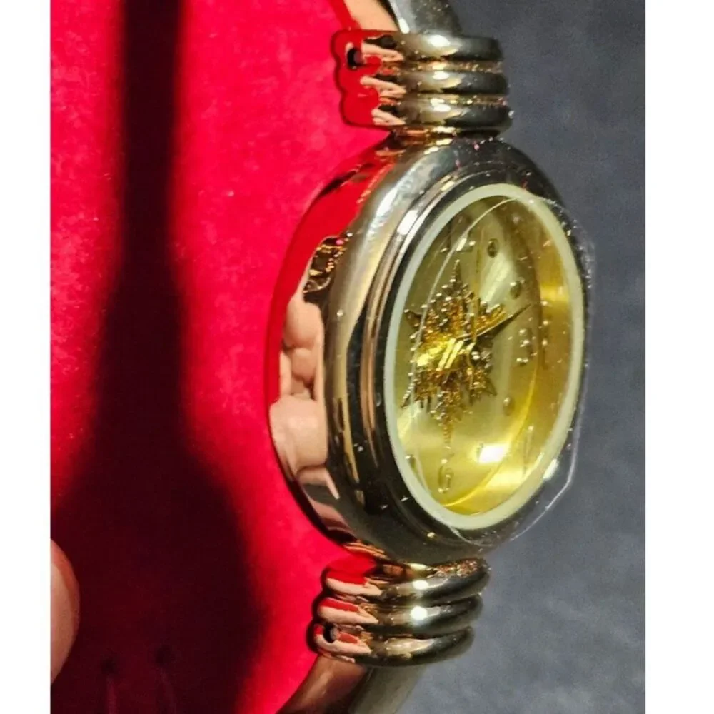 Holiday Lane gold tone snowflake watch